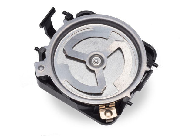 Round metal and plastic ultrasonic sensor component with exposed internal metal diaphragm and black plastic housing, viewed from the bottom side on a white background.