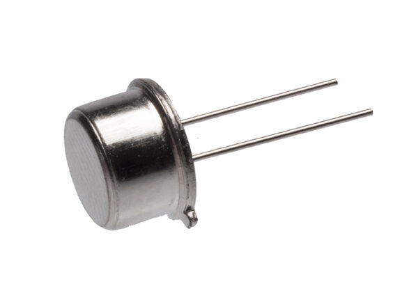 Compact metal ultrasonic transducer with a smooth front face and two long metal pins extending from the rear, photographed on white background.