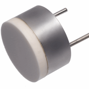 Small, round ultrasonic transducer with metallic housing and white ceramic front surface, shown isolated on white background.