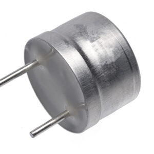 Small silver ultrasonic transducer viewed from the back showing a flat white rear surface and two metal pins extending outward.