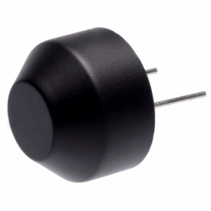 Black plastic ultrasonic sensor with domed front surface and two metal pin leads extending from the back, shown angled on white background.