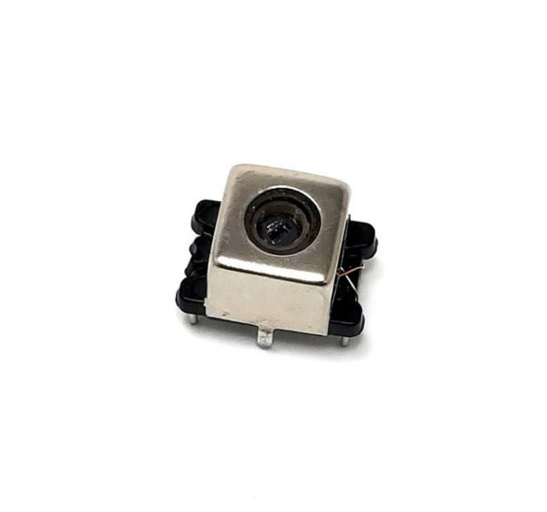 Square metallic electronic inductor with a central circular opening, mounted on a black plastic base with four pins, shown on a white background.