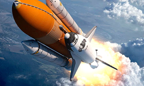 Space shuttle launching with engines igniting against a cloudy sky