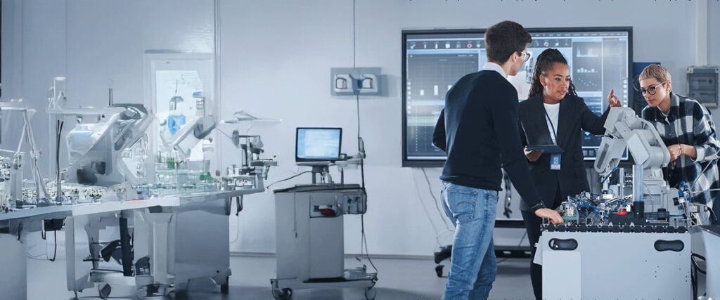 Technology lab featuring robotics systems and computer monitors for STEM education