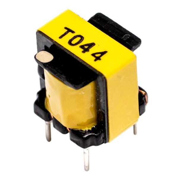 Yellow rectangular electronic transformer labeled T044 with black plastic frame and four metal pins, shown angled on a white background.