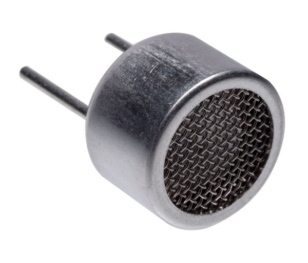 Side view of metal ultrasonic sensor with fine mesh front grill and two pin connectors extending from the back, shown on white background.