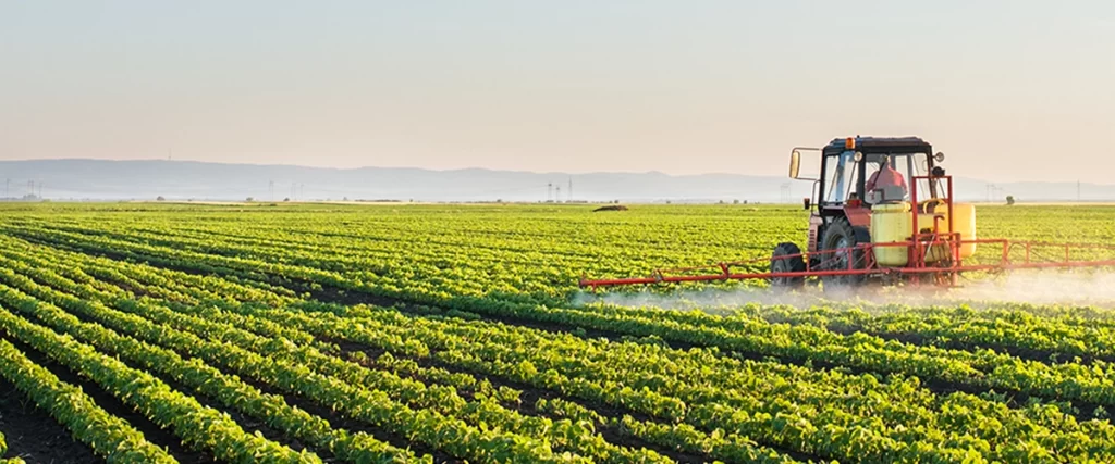 tractor spraying a field